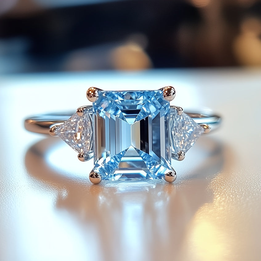 Custom Emerald-Cut Blue Topaz Three-Stone Engagement Ring
