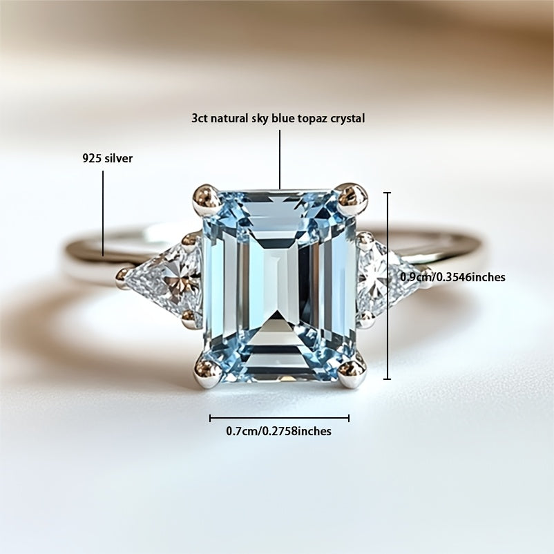Custom Emerald-Cut Blue Topaz Three-Stone Engagement Ring